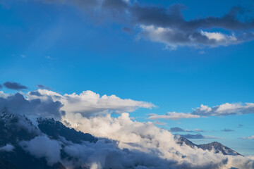 The natural beauty of Gongga snow mountain and blue sky and white clouds in Western Sichuan, China