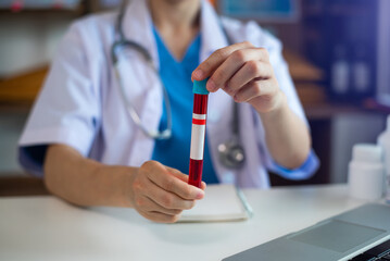 Coronavirus blood test, Doctor holding test glass tube Medical  concept.