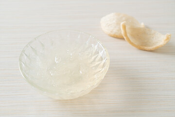 Edible bird's nest soup in glass bowl