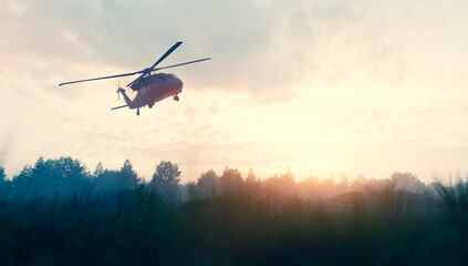 Military helicopter flying over battlefield at war - obrazy, fototapety, plakaty
