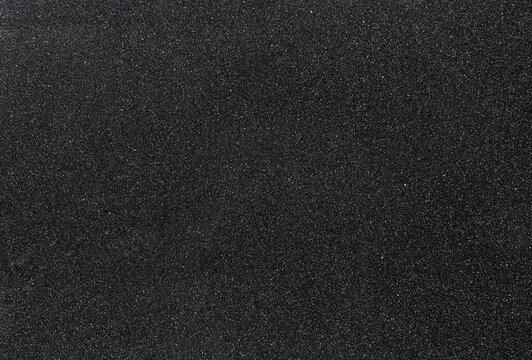 Dark stone desk texture with concrete background in high resolution. Top view on a table with copy space. Idea for advertising, banner or product article