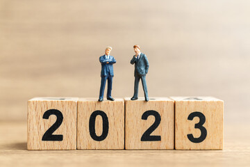 Miniature people , Business people Planning to Successful Project in 2023, Happy New Year Concept
