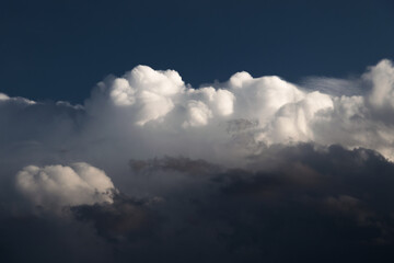Dramatic blue sky with white clouds.