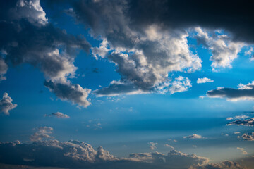 Dramatic blue sky with white clouds.