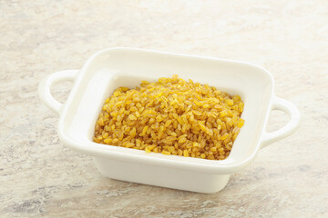 Raw bulgur in the bowl