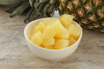 Marinated pineapple slices in the bowl