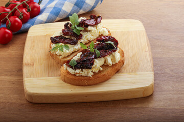 Bruschetta with soft cheese and tomato