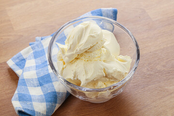 Italian soft mascarpone cheese in the bowl