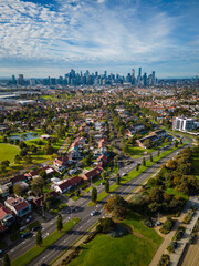 Fototapeta premium Aerial view of Melbourne CBD and coastal suburb