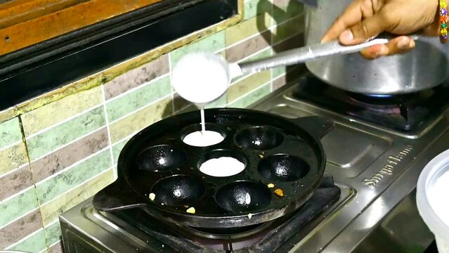 Idli or idly cooking on idli Tava popular breakfast of South India