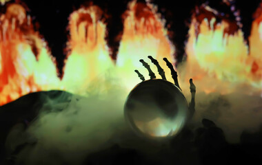 Skeleton Zombie Rising Out Of A GraveYard - Halloween. Mysterious magic ball predictions and smoke...