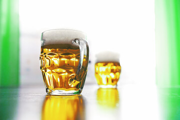 Saint Patrick's Day holiday. National Irish holiday. A mug of golden beer at the bar.