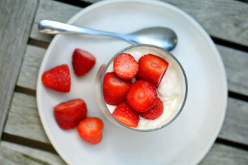 Glass with yogurt and strawberries
