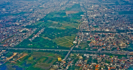 Jakarta Bay view from the airplane window that looks crowded and busy