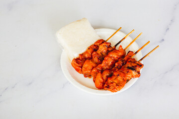 grilled skewered milk pork with white sticky rice - local Thai street food style