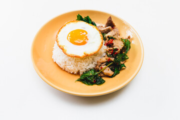 Thai Food Stir-Fried Chicken Spicy and Basil served with Rice ,Fried egg  white plate side view isolated on background