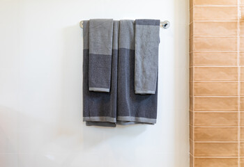 bathroom towel dryer on gray wall background with copy space