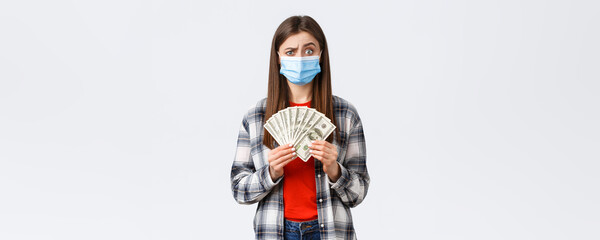 Money transfer, investment, covid-19 pandemic and working from home concept. Doubtful and confused...