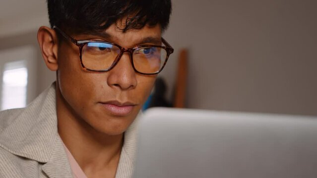 Serious young Asian male online