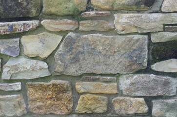 old stone wall background, colored stones texture