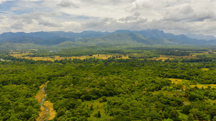 Obraz premium Rustic landscape with agricultural lands and farms among mountains and forests. Sri Lanka.
