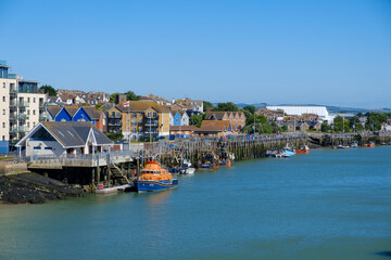 Fototapeta premium Waterfront properties by the harbour in Newhaven, East Sussex, England