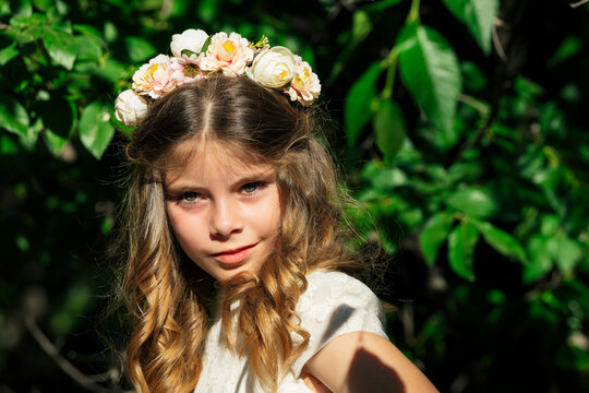Smiling girl wearing flower crown in forest
