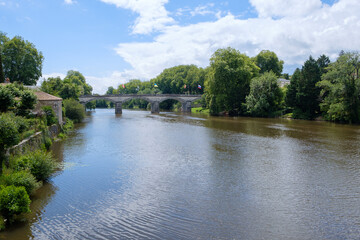 Scenic view on a summer day of bridge over the Charente river, Confolens, Poitou-Charentes, Aquitaine, France