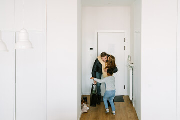 Happy adoptive sisters meeting their father who came home