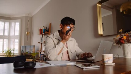 Asian man leaving voice note message