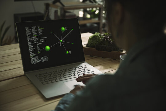 Freelancer using laptop on table at home office