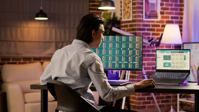 Hedge fund trader analyzing real time stock market statistics on computer and laptop screen. Global investment with financial profit on forex trade exchange, money banking sales.