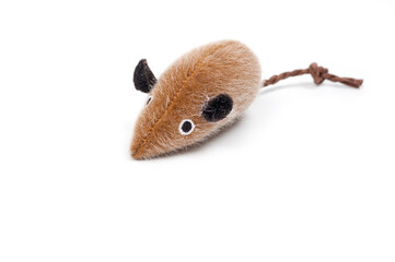Toy soft mouse with a pet tail, shot on a white background.