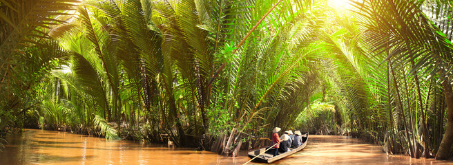 People boating in the delta of Mekong river, Vietnam