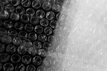 Transparent white grey paper bubble wrap sheet made from polyethylene or PE with dark grey...