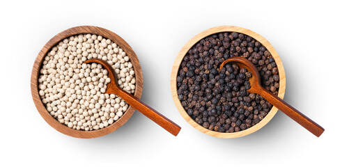 White and black pepper seeds in wooden bowl isolated on white background, top view, flat lay.