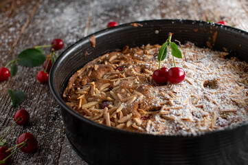 Sour cherry cake with almond topping in a springform baking pan