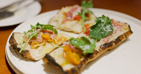 Friends eat pizza together in restaurant