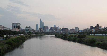 Fototapeta na wymiar Taipei city skyline with keelung river in the evening