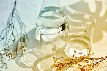 Scientific glassware, Beaker and cylinder, Natural organic skincare cosmetic beauty products,...