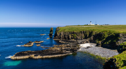 Fototapeta na wymiar panorama view of the wild Caithness coast and the Noss Head Lighthouse