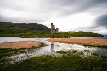 long exposure view of the Ardvreck Castle on Loch Assynt in the Scottish Highlands