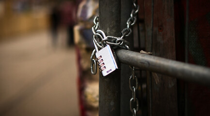 Padlock on a chain. Locked and locked. mysterious and safe. Detail