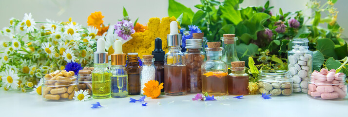 Tinctures, extracts, oils and dietary supplements from medicinal herbs. Selective focus.