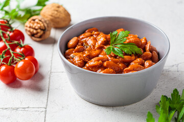 Lobio - dish of Georgian cuisine. Red bean stew with tomato sauce, nuts and herbs.