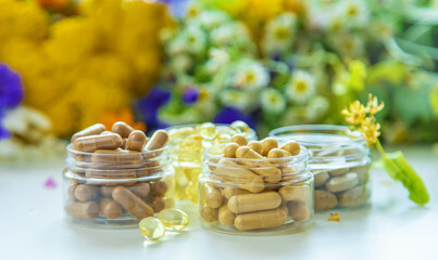 Homeopathy and dietary supplements from medicinal herbs. Selective focus. - obrazy, fototapety, plakaty