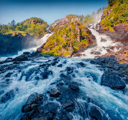 Majestic morning view of Latefoss waterfall, located in the municipality of Odda in Hordaland...