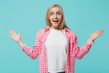 Young shocked excited fun amazed surprised woman she 30s wear pink shirt white t-shirt look camera...