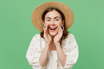 Young happy promoter fun woman she 20s wear white dress hat scream hot news about sales discount with hands near mouth isolated on plain pastel light green background studio. People lifestyle concept