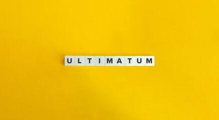 Ultimatum Word on Letter Tiles on Yellow Background. Minimal Aesthetics.